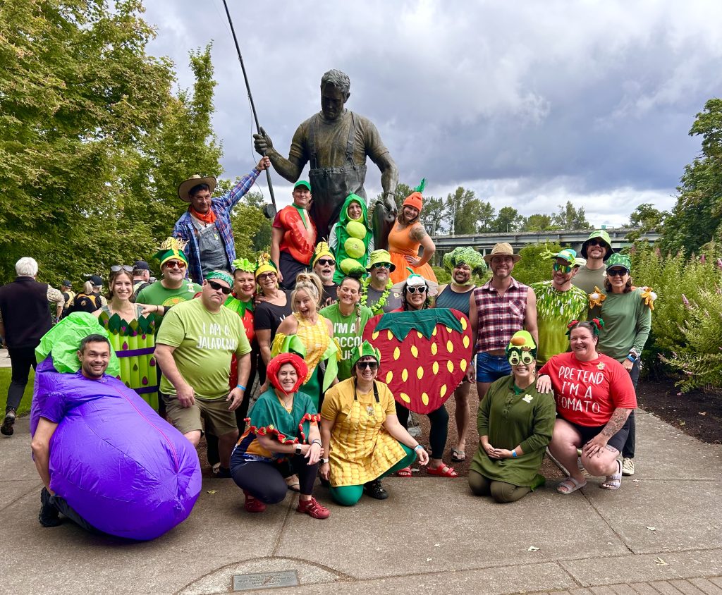 Crew dressed as fruits and vegetables at a farmers market